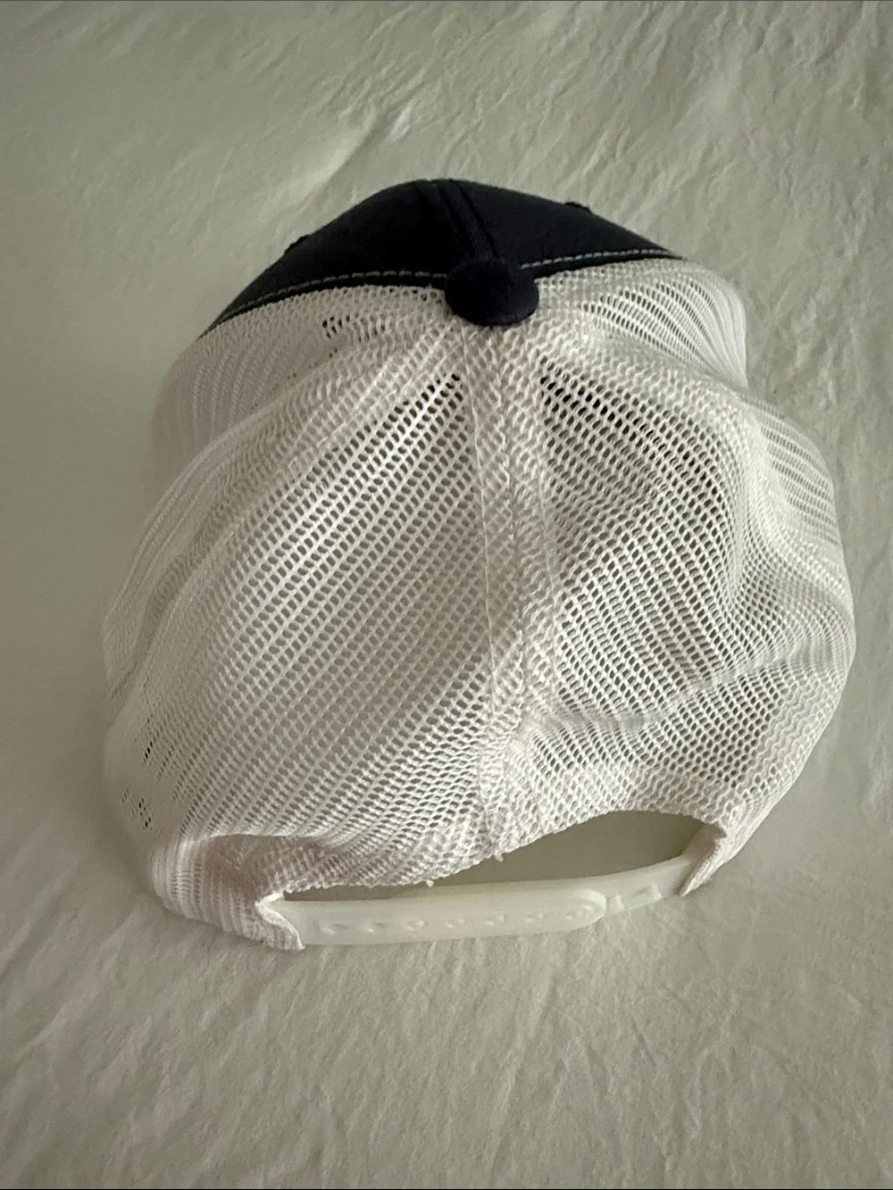 New Bedford Ship Supply Navy & White Trucker Hat with Red Boat Embroidery